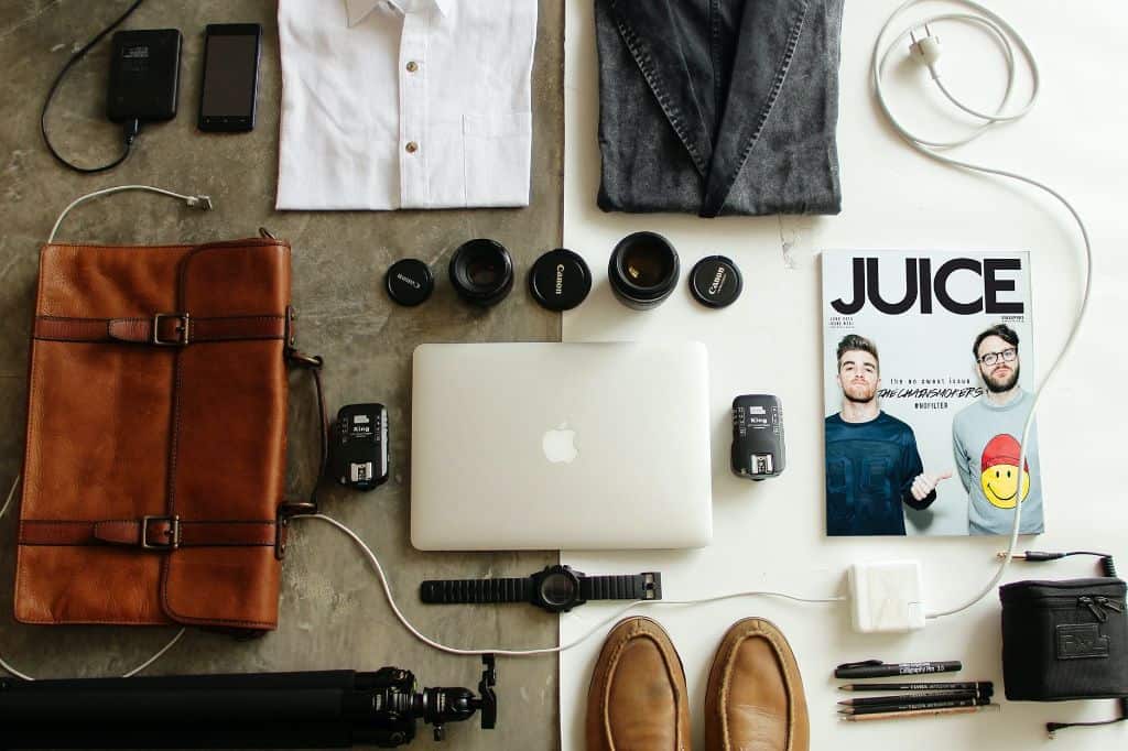 How to pack a suitcase Photo by OVAN: https://www.pexels.com/photo/brown-leather-bag-clothes-and-macbook-57750/