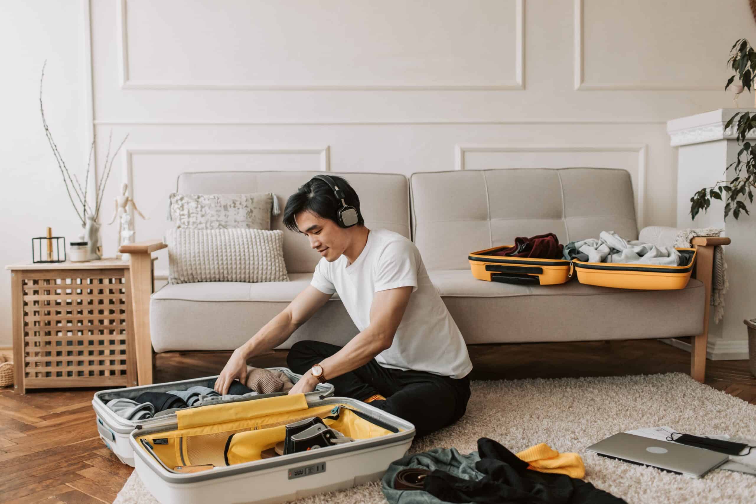 Photo by Vlada Karpovich: https://www.pexels.com/photo/a-man-listening-on-his-headphones-while-packing-his-clothes-7365334/