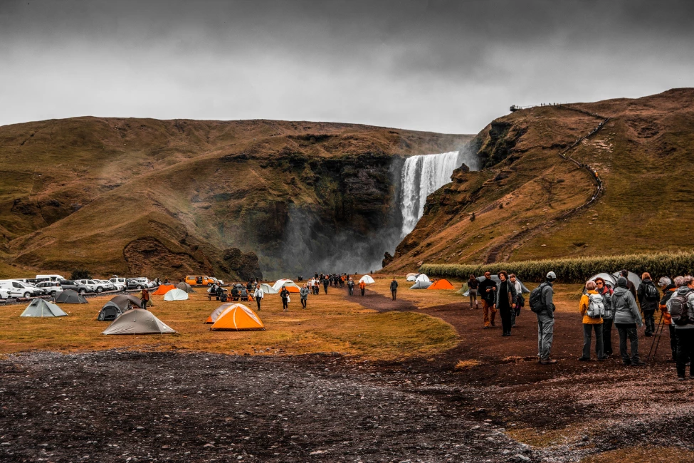 Photo by David Geib: https://www.pexels.com/photo/people-standing-on-camping-site-near-waterfalls-3220760/